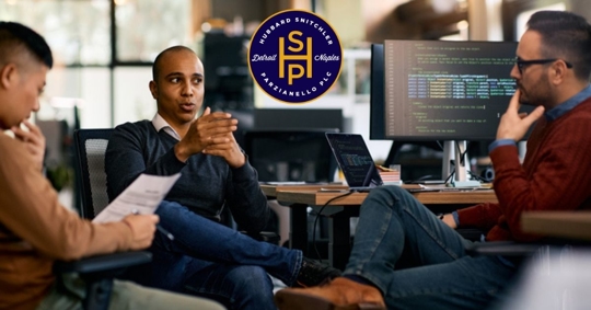 A group of business colleagues communicating on a meeting in the office.